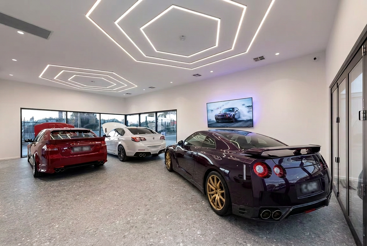Power Tech Tuning showroom with a dark purple Nissan R35 GT-R on gold wheels