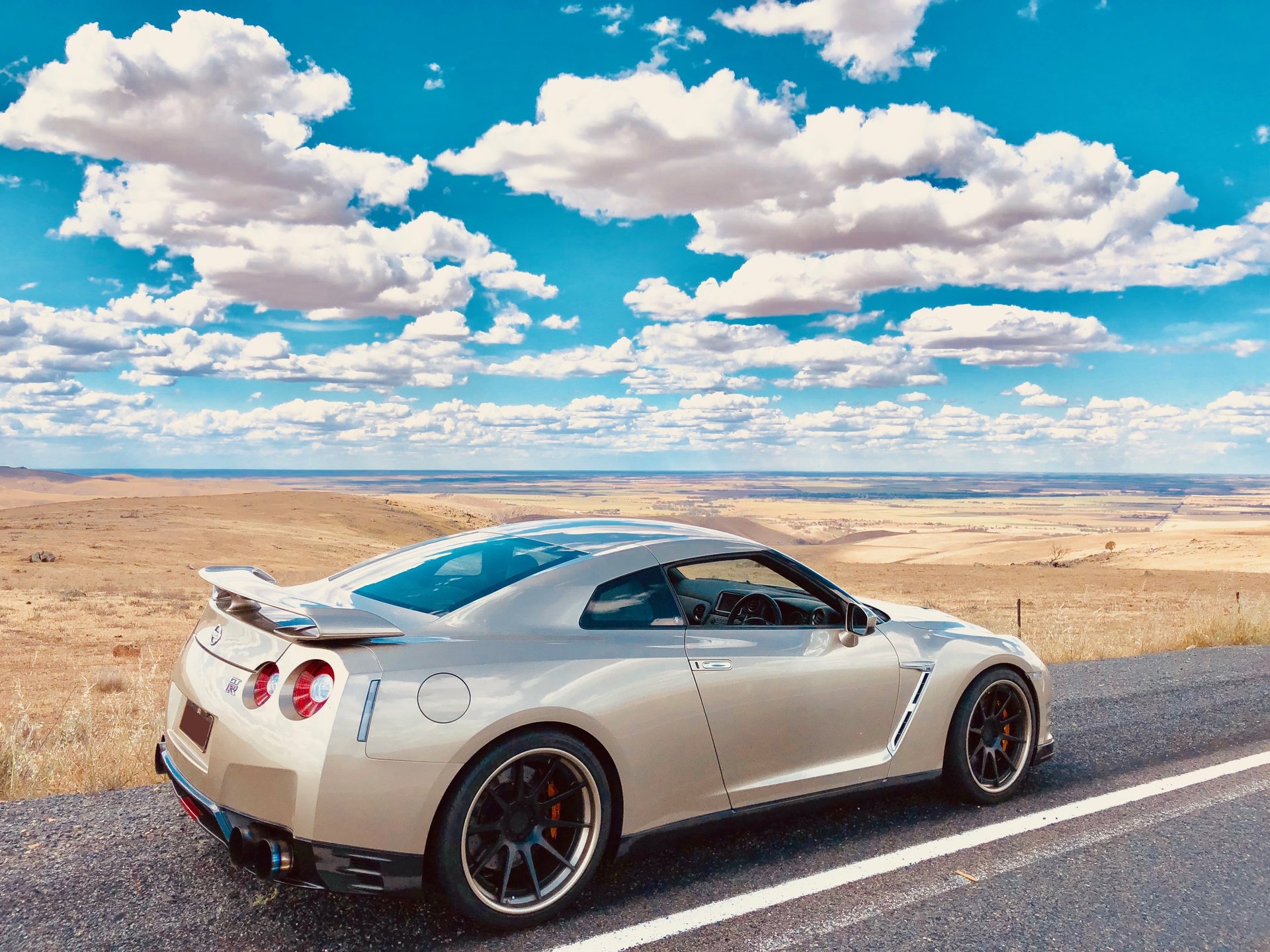 The workshop's silver Nissan R35 GT-R roadside in the South Australian mid north